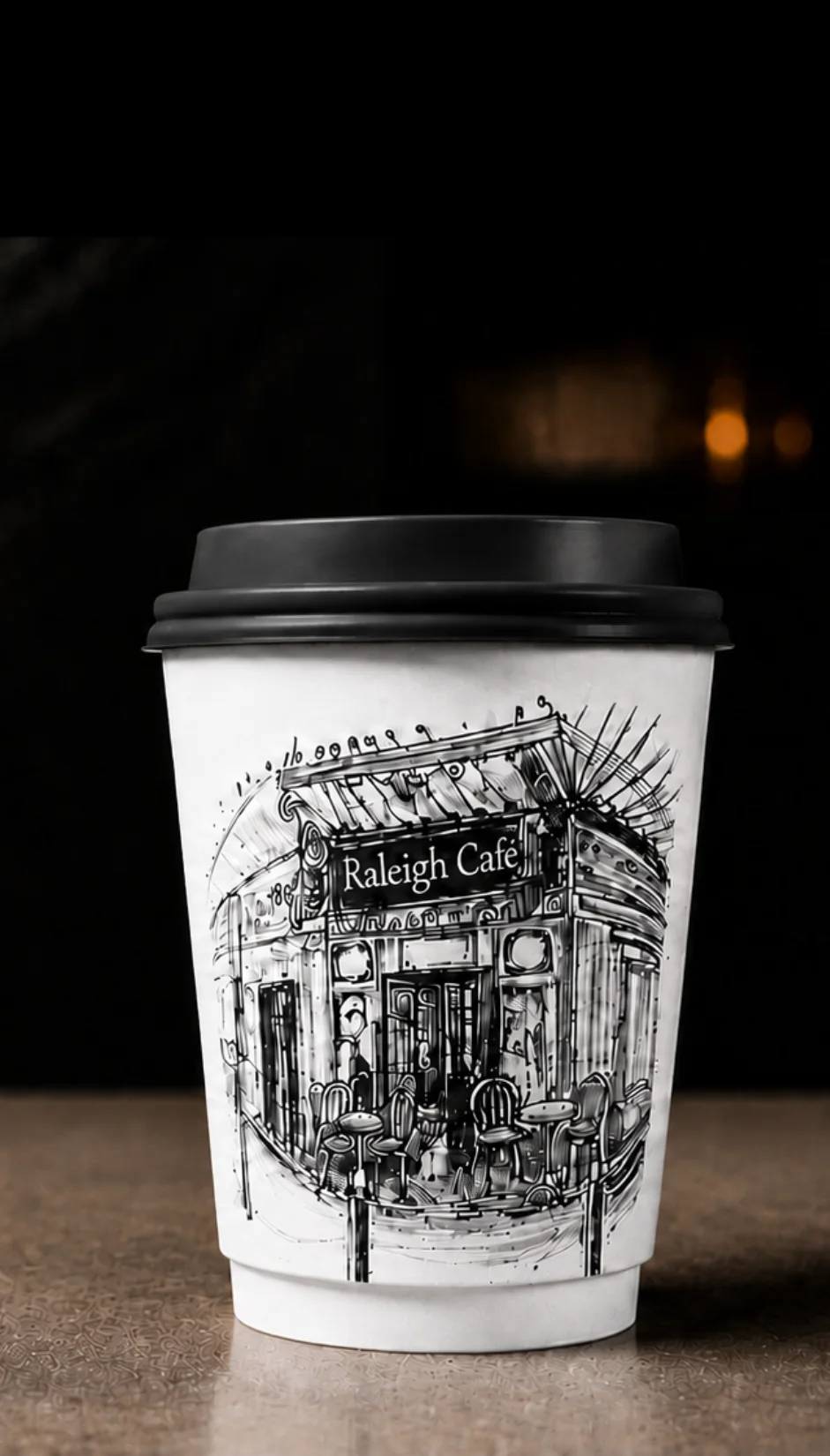 Jason's Coffee takeout cups with typographic labels on a dark backdrop